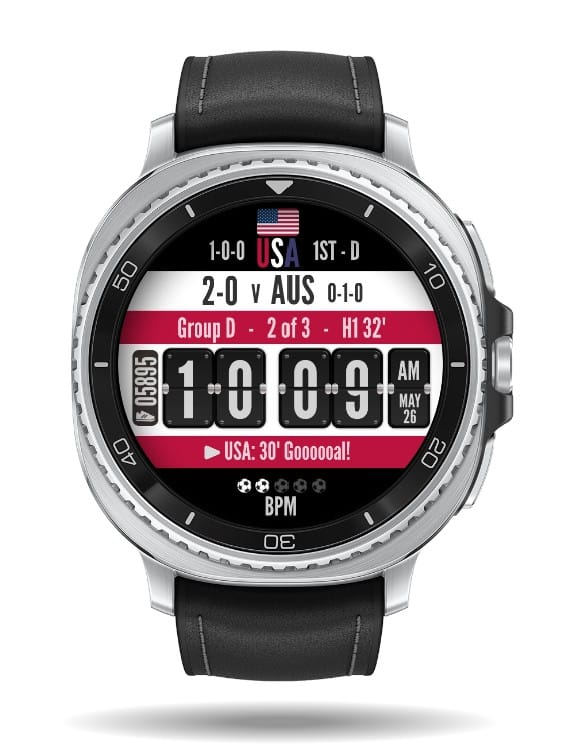 Tampilan watch face Facer Kick It di smartwatch Wear OS yang menunjukkan skor pertandingan Piala Dunia dengan desain bendera nasional